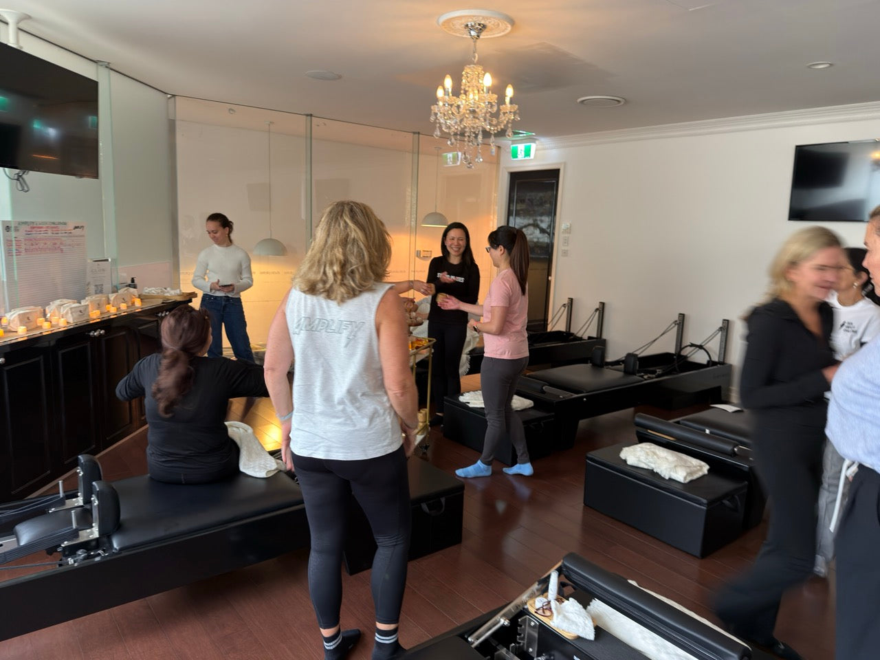 Reformer studio transitioning into a quiet post-class skincare gathering space